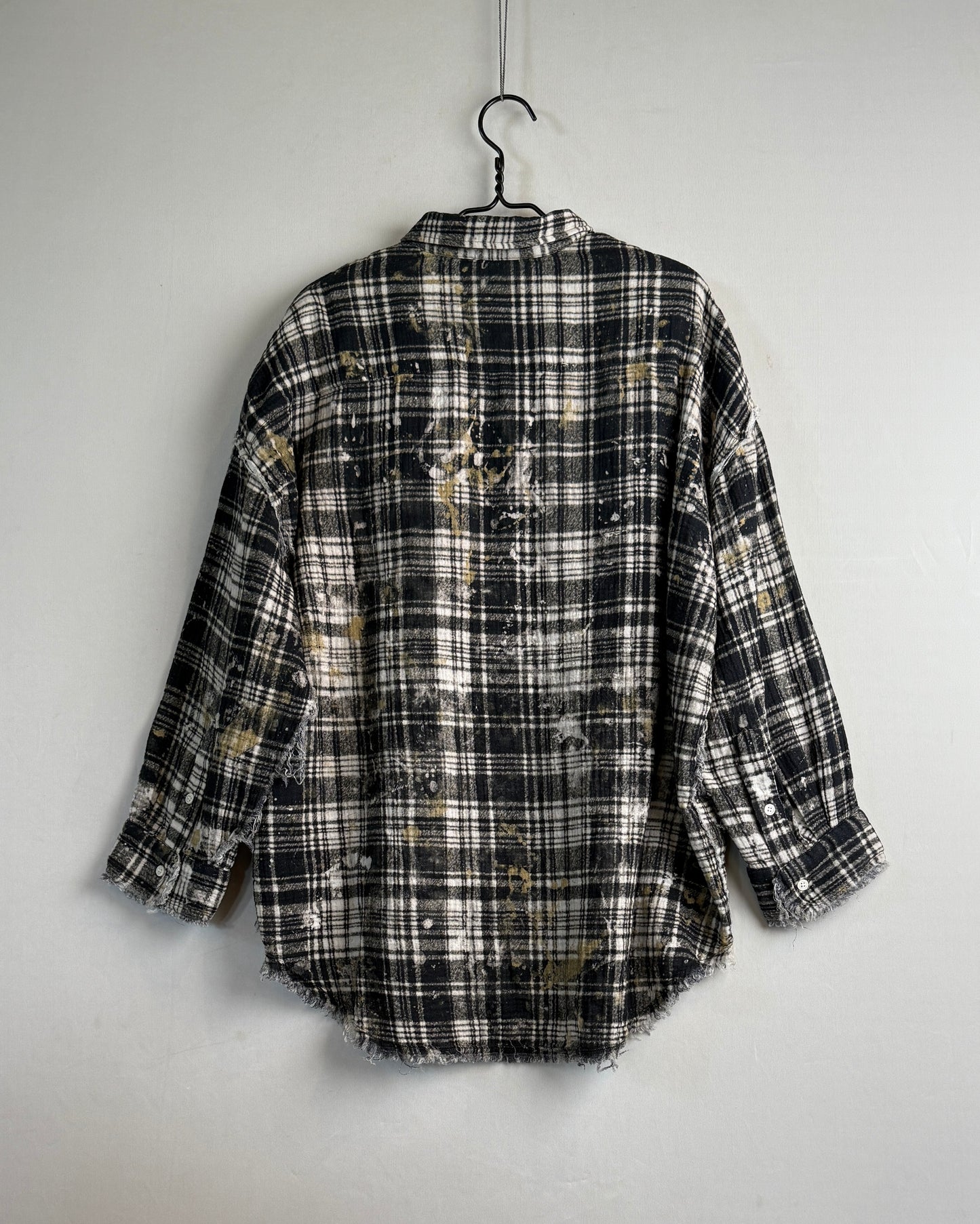 Shredded seam drop neck shirt