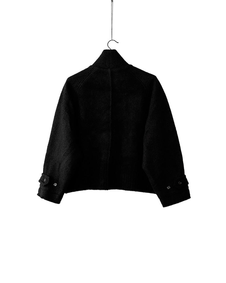 Short wool trench coat with knitted yak arms