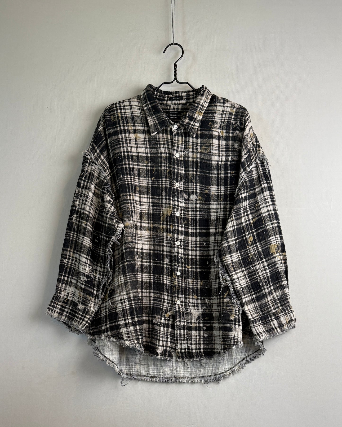 Shredded seam drop neck shirt