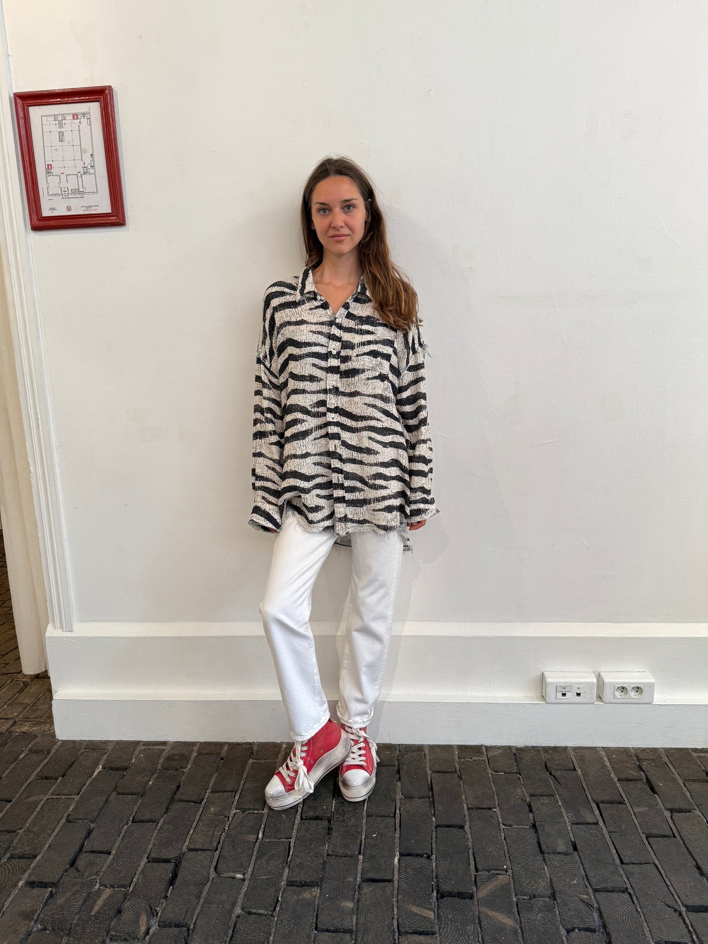 Shredded seam drop neck shirt