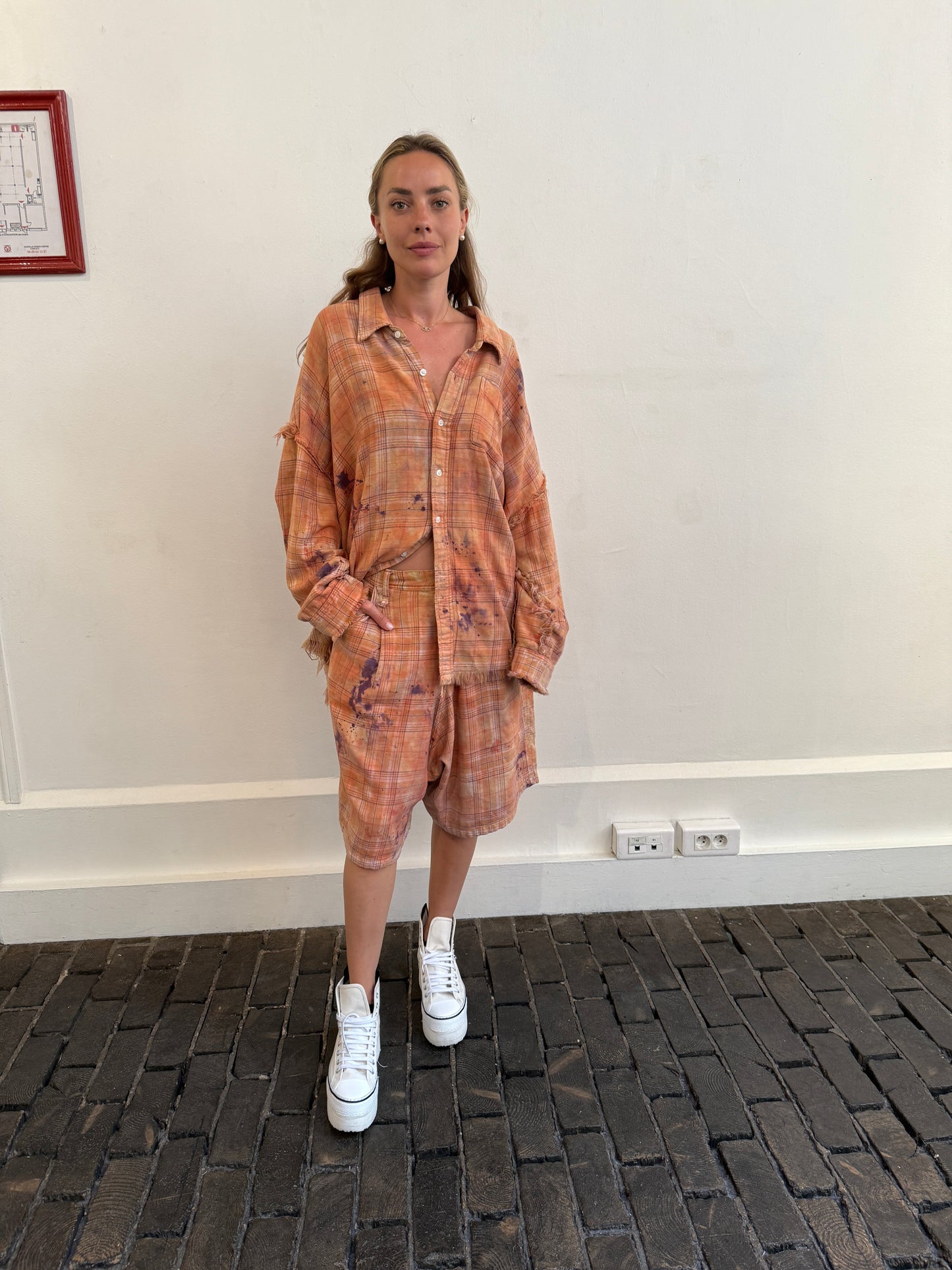 Shredded seam drop neck shirt