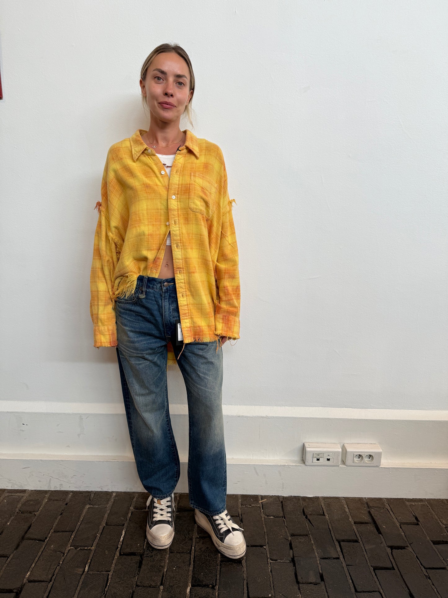 Shredded seam drop neck shirt