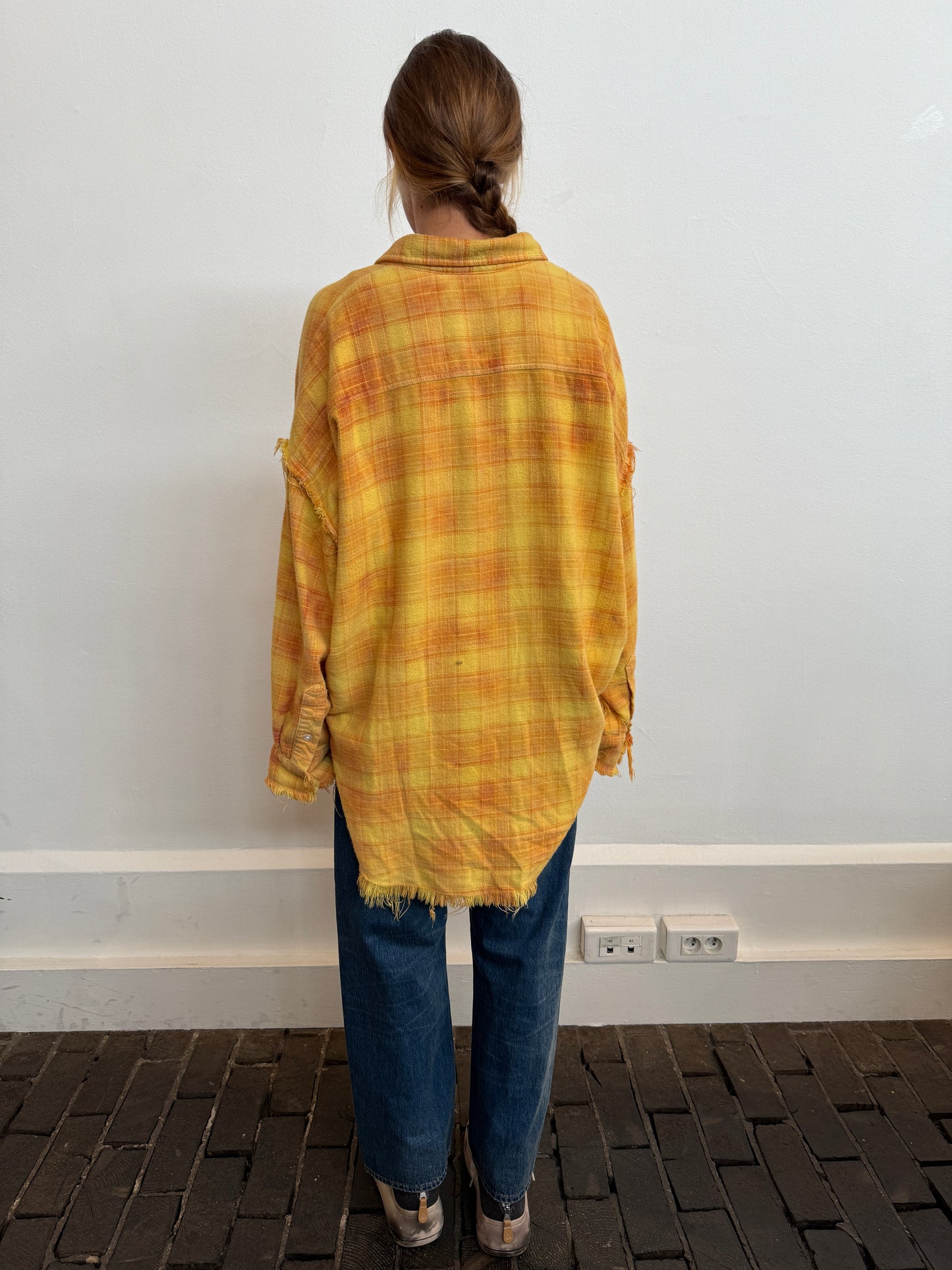 Shredded seam drop neck shirt